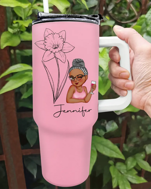 Personalized pink 40oz tumbler with a floral sketch and custom name, ideal for gifts.